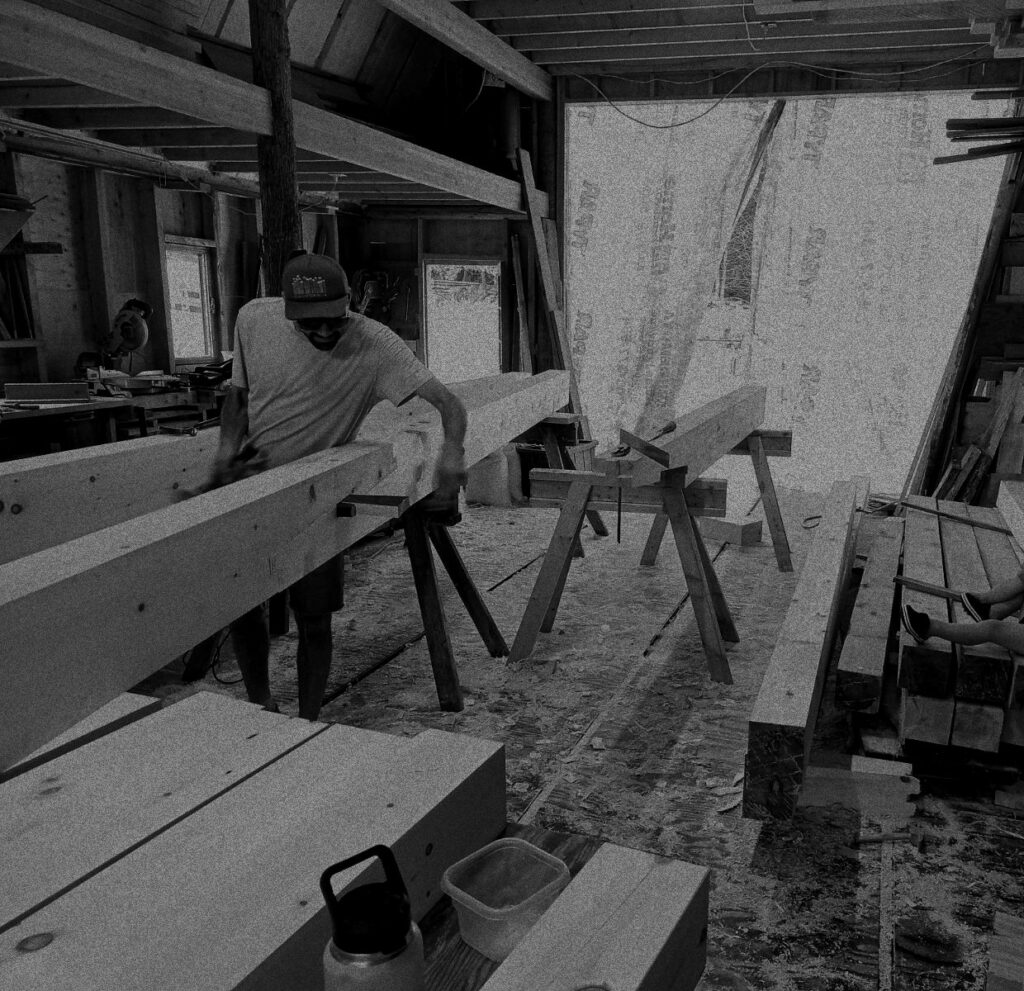 Working a timber down on sawhorses in the shop