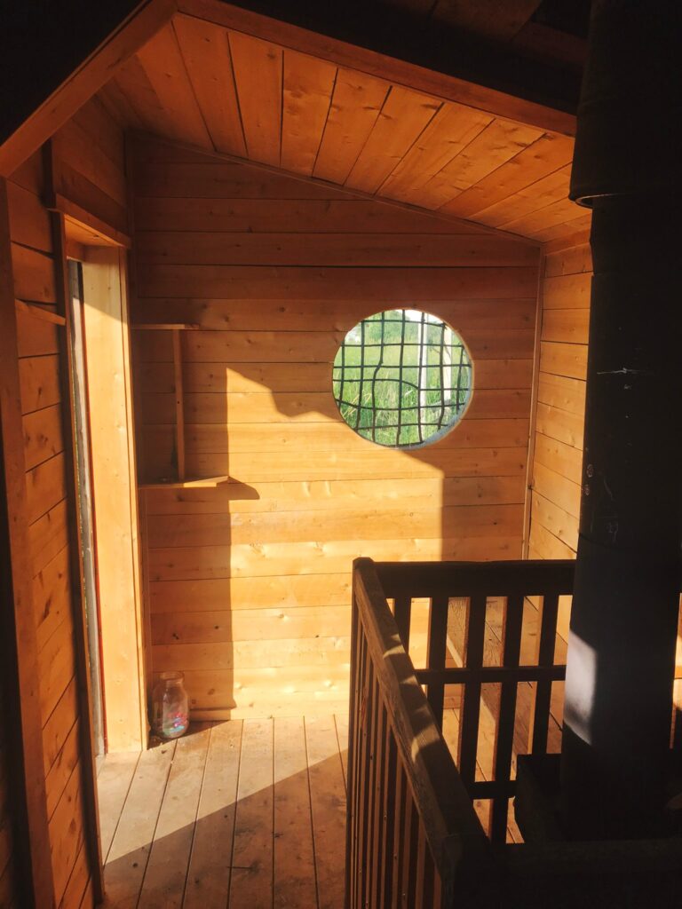 Sunlight through the round window on the cedar boards inside